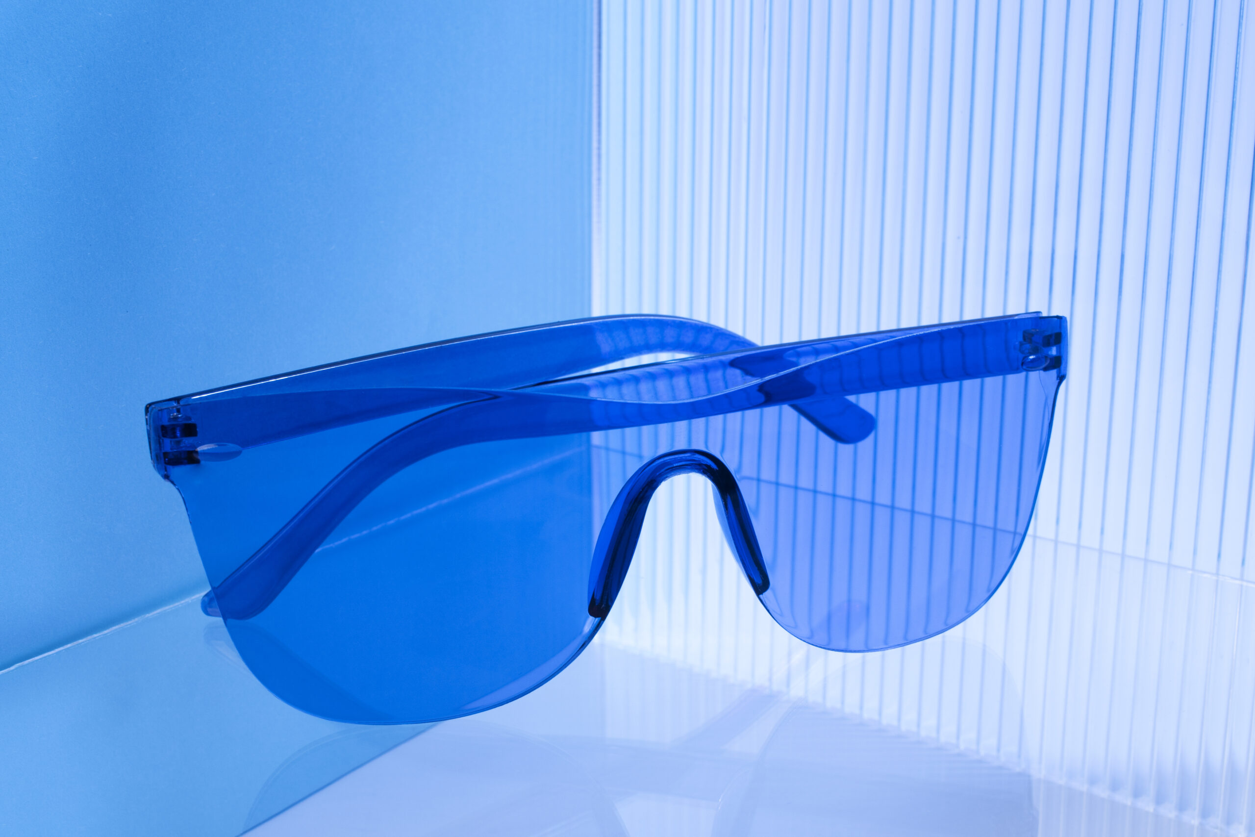 colored transparent sunglasses still life